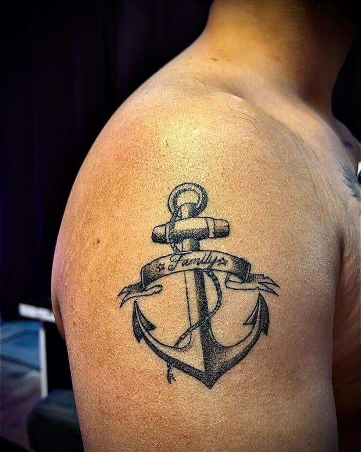 14. Shoulder anchor tattoo with the word Family