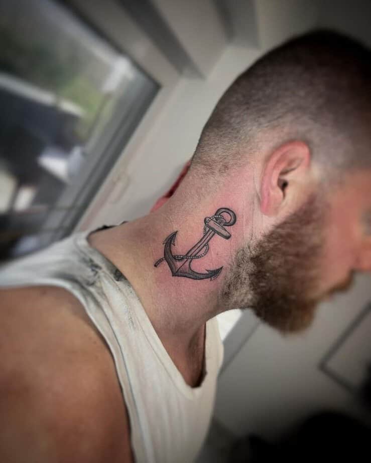 18. An anchor tattoo below the ear