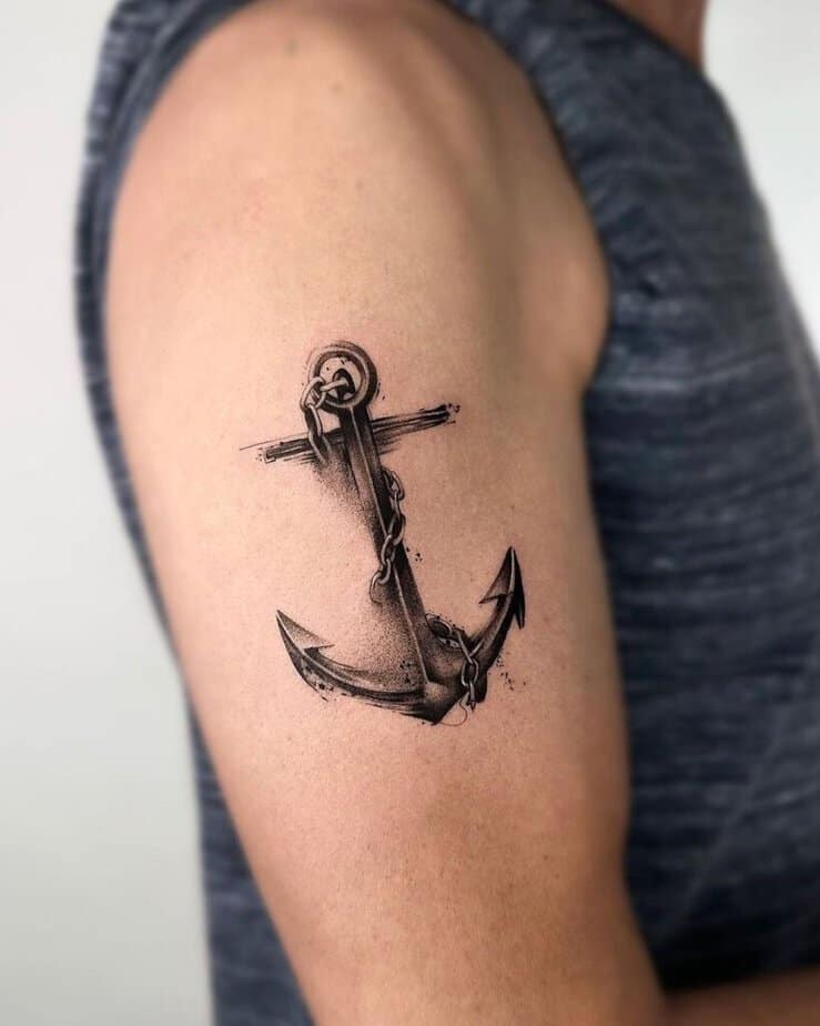 2. Beautiful black and grey anchor tattoo on the upper arm