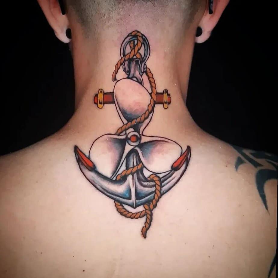 20. Symbolic propeller and anchor tattoo
