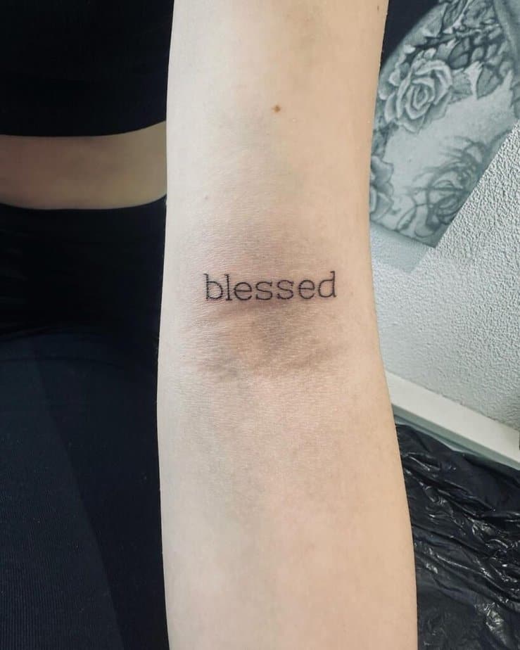 Minimalistic blessed tattoo