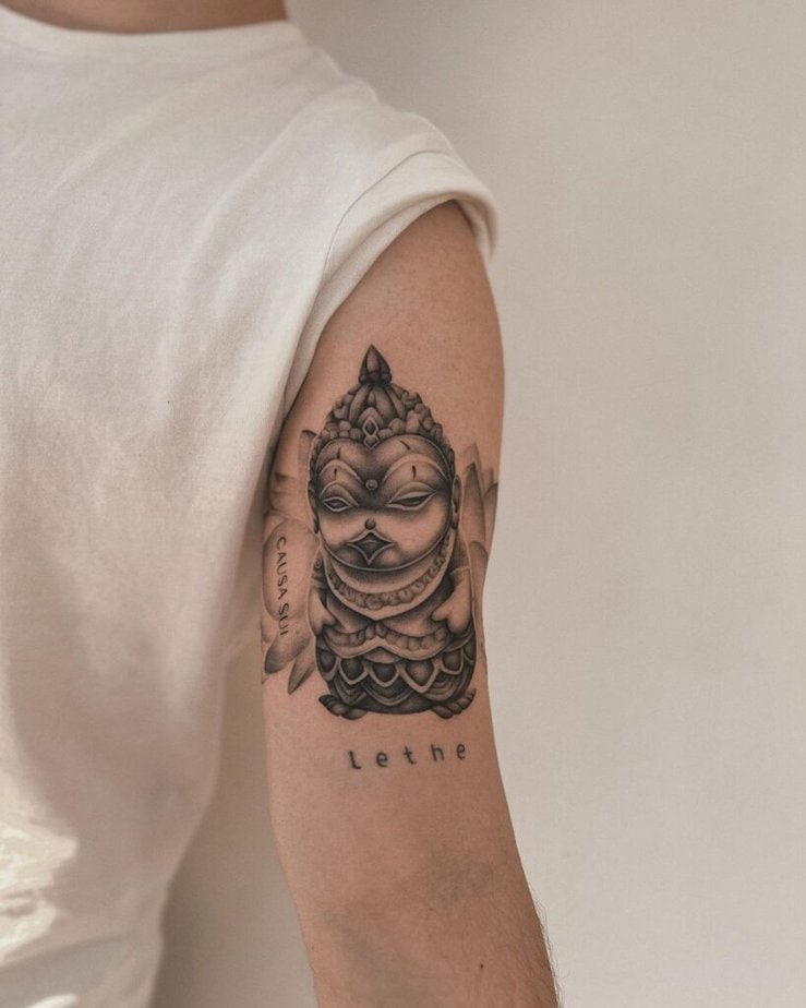1. A duck Buddha tattoo on the upper arm