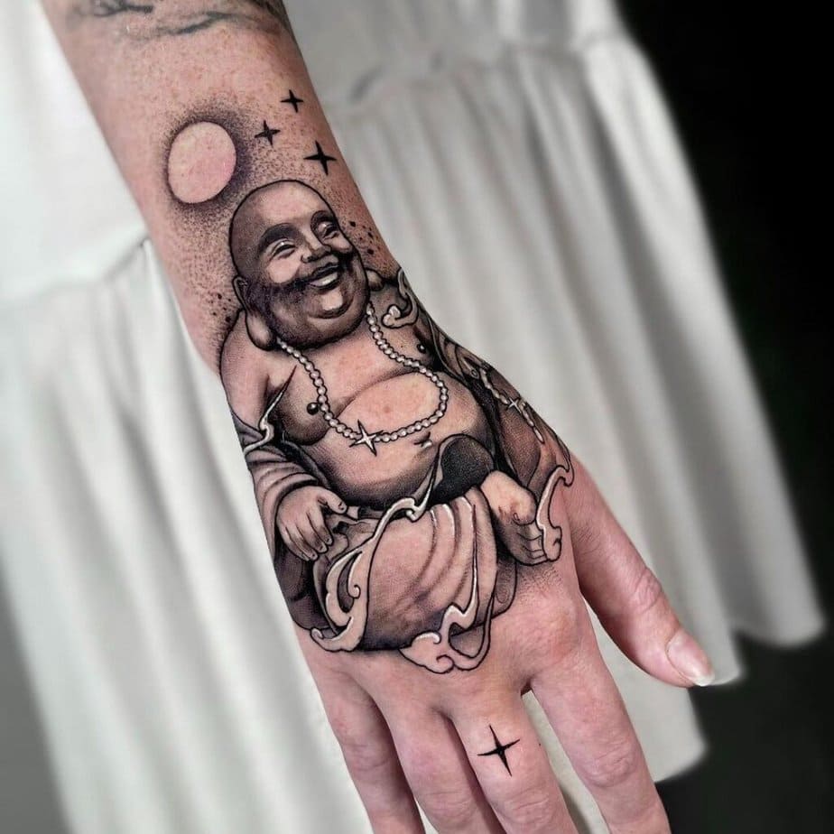 13. A beautiful Buddha tattoo on the hand