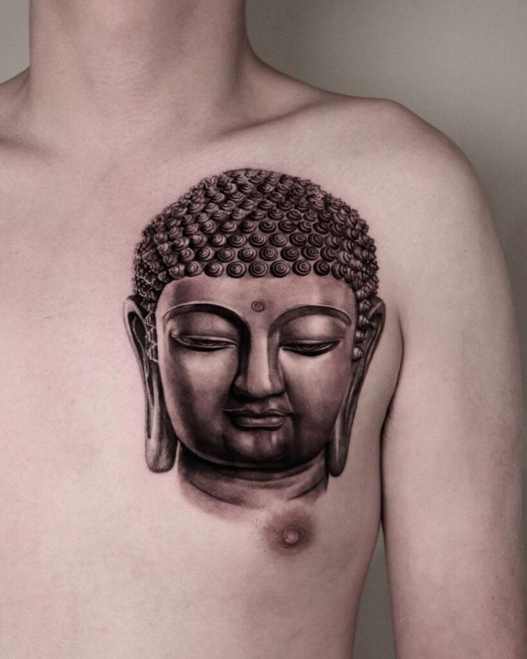 21. A Buddha chest tattoo 