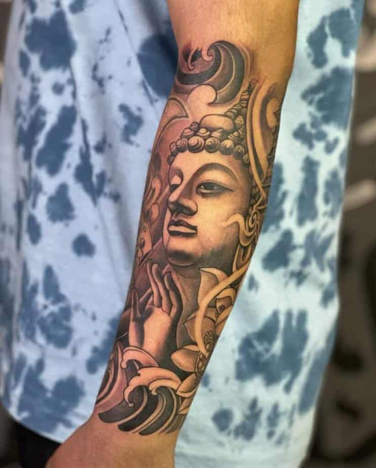 7. A Buddha tattoo on the forearm