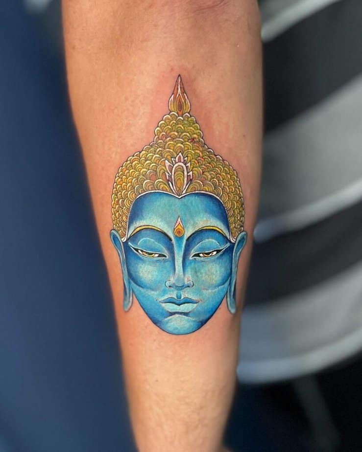 9. A blue Buddha tattoo 
