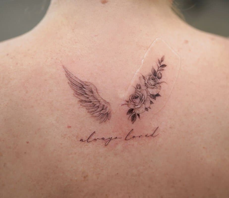 7. A tattoo of wings with a mantra
