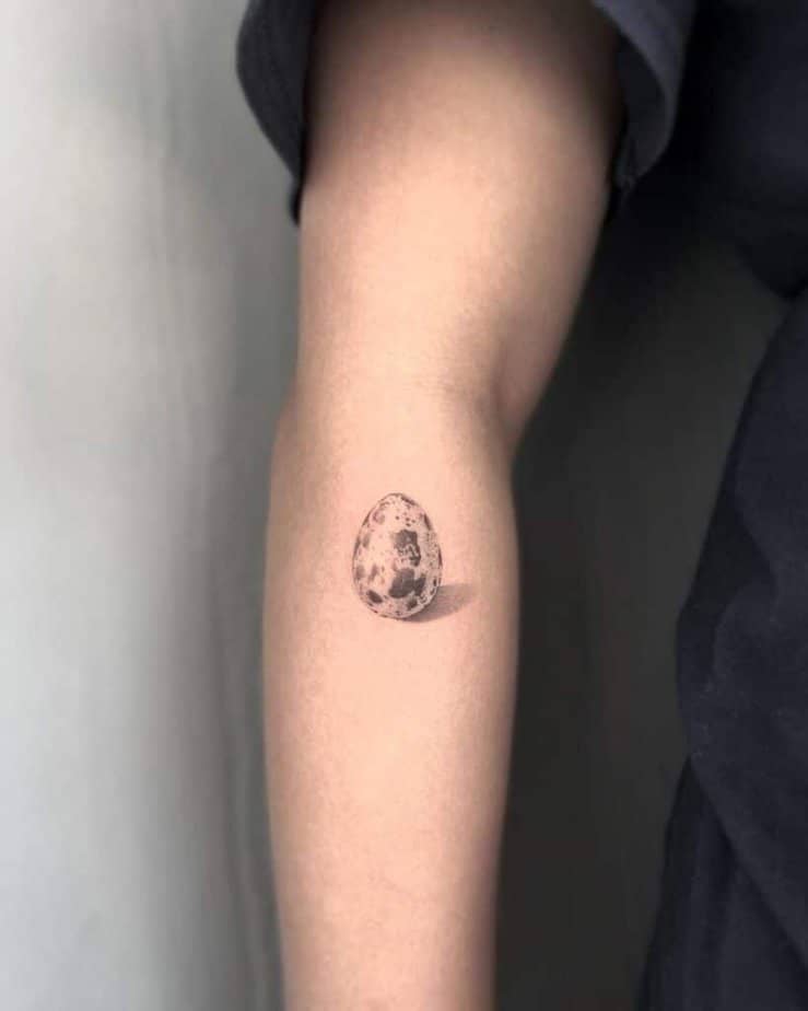 10. A quail egg tattoo on the forearm 