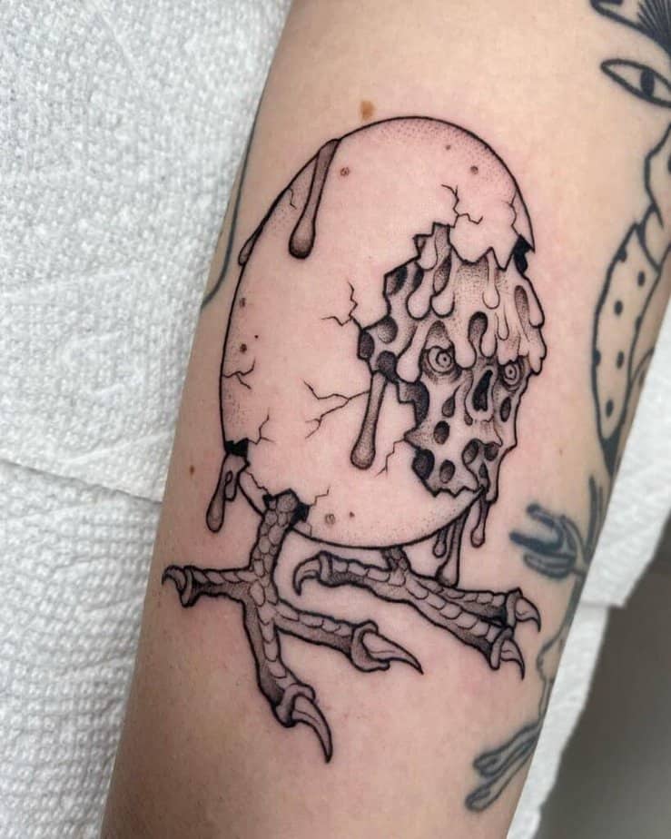 14. A tattoo of a monster egg