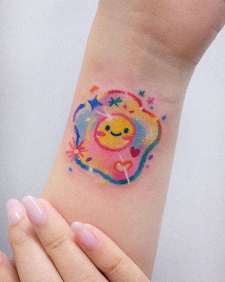 21. A colorful egg tattoo on the wrist