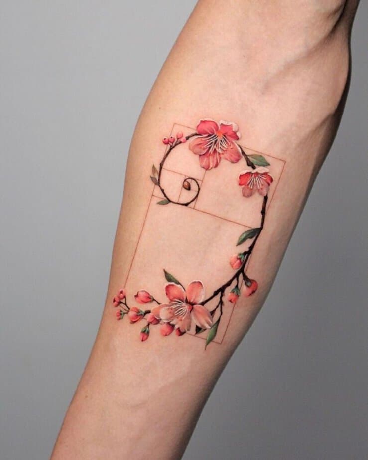 22. A colored cherry blossom Fibonacci tattoo