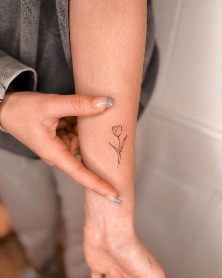 19. A tulip tattoo on the wrist