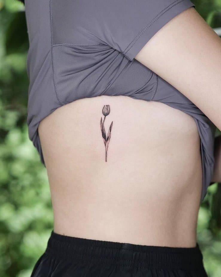 4. A rib tattoo of a tulip