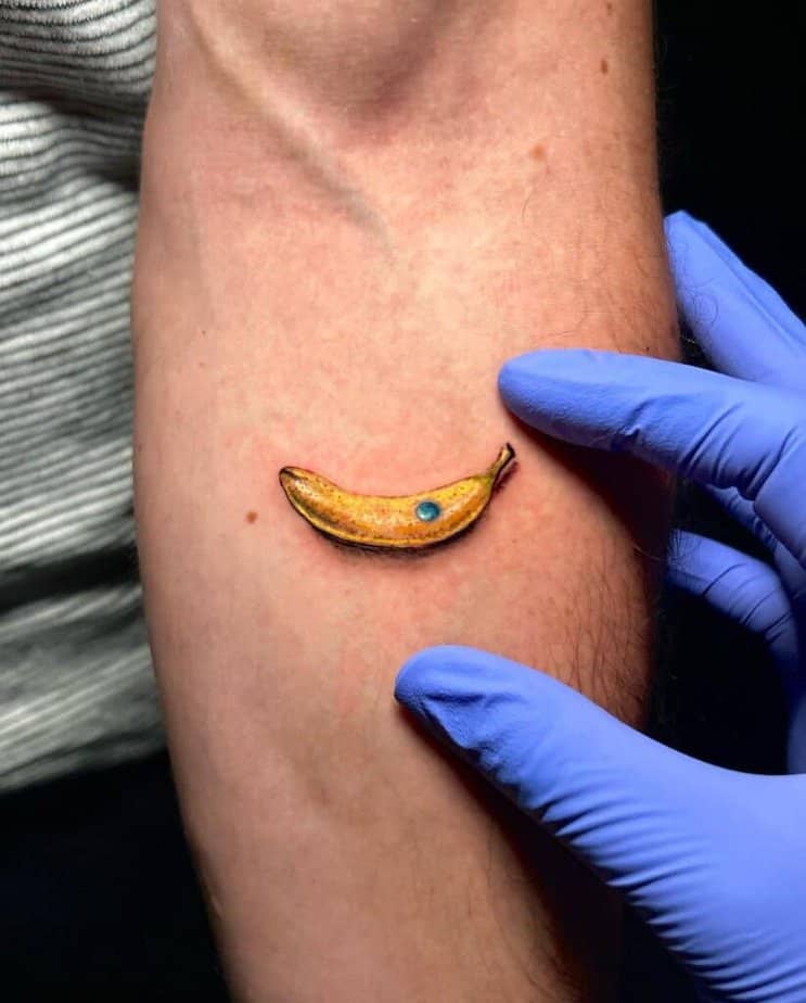 17. A micro realism banana tattoo 