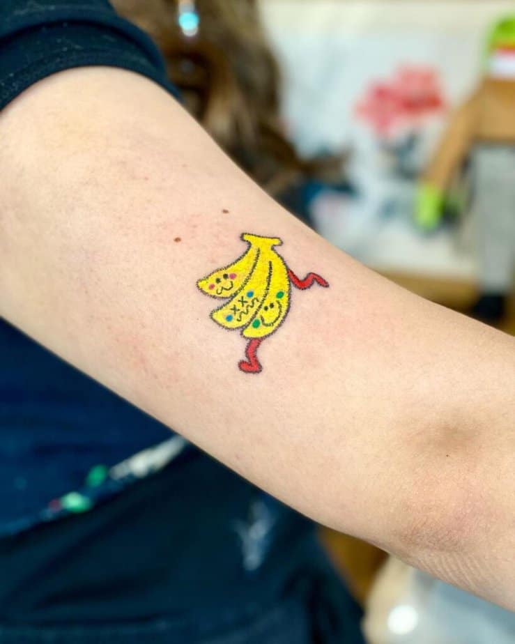 23. A colorful banana man tattoo 
