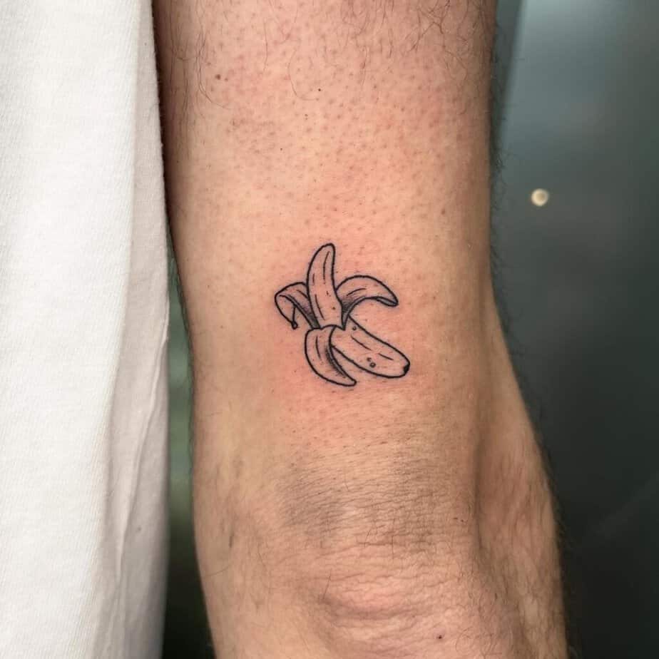 4. A tiny banana tattoo on the back of the arm