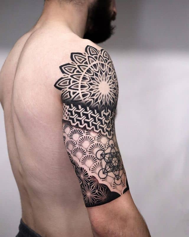 1. Cool geometric half-sleeve tattoo