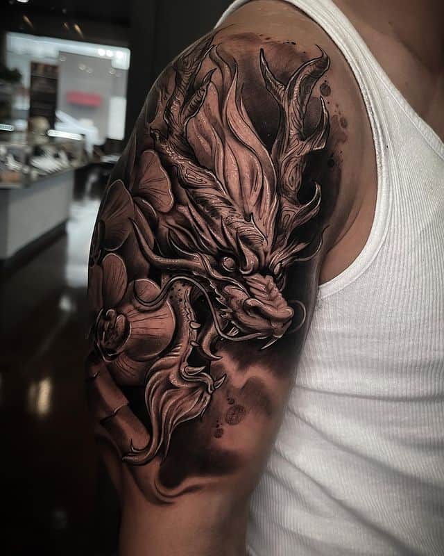 2. Amazing dragon sleeve tattoo