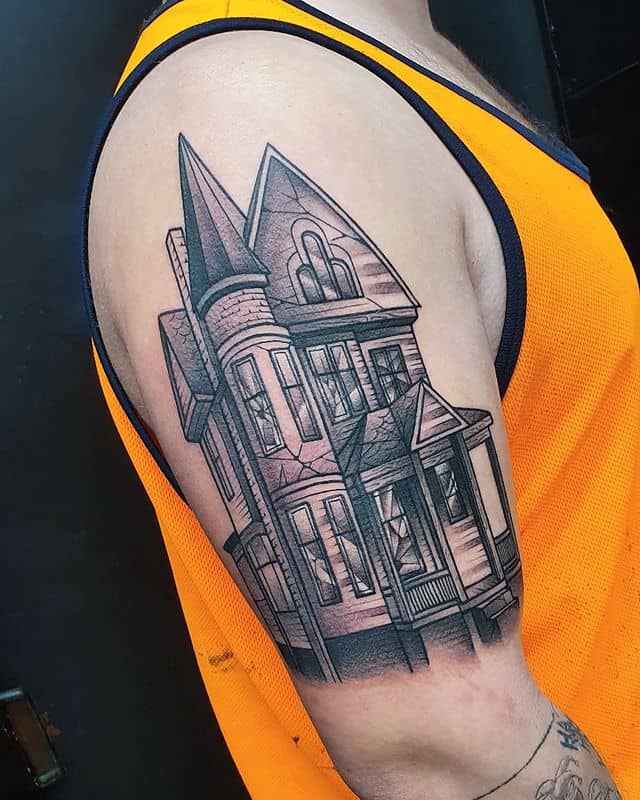 23. Haunted house half-sleeve tattoo
