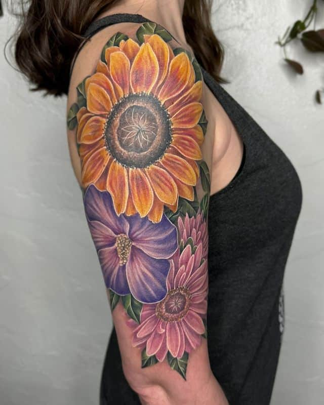 3. Colorful girlie half-sleeve tattoo
