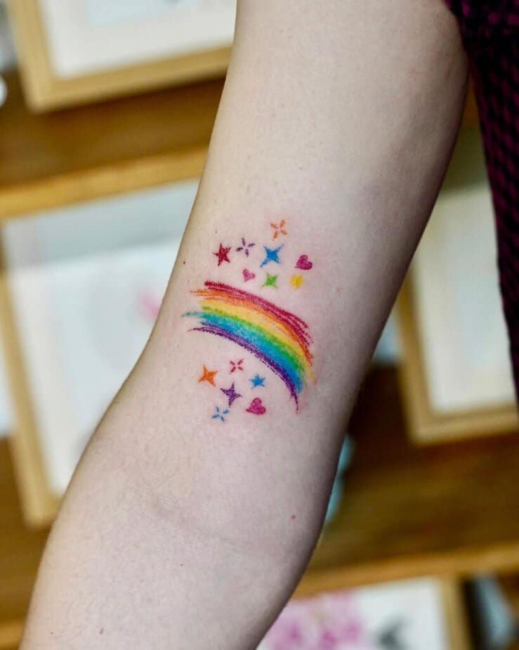 10. A crayon tattoo of a rainbow, stars, and hearts