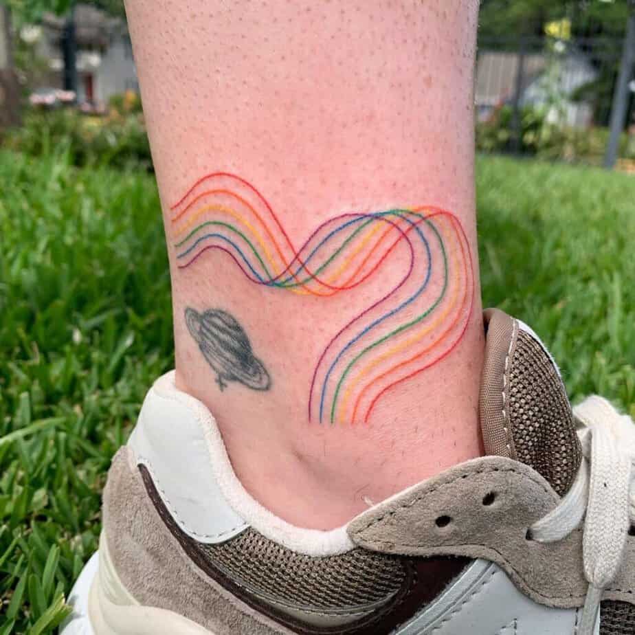 14. A squiggly rainbow tattoo on the ankle 