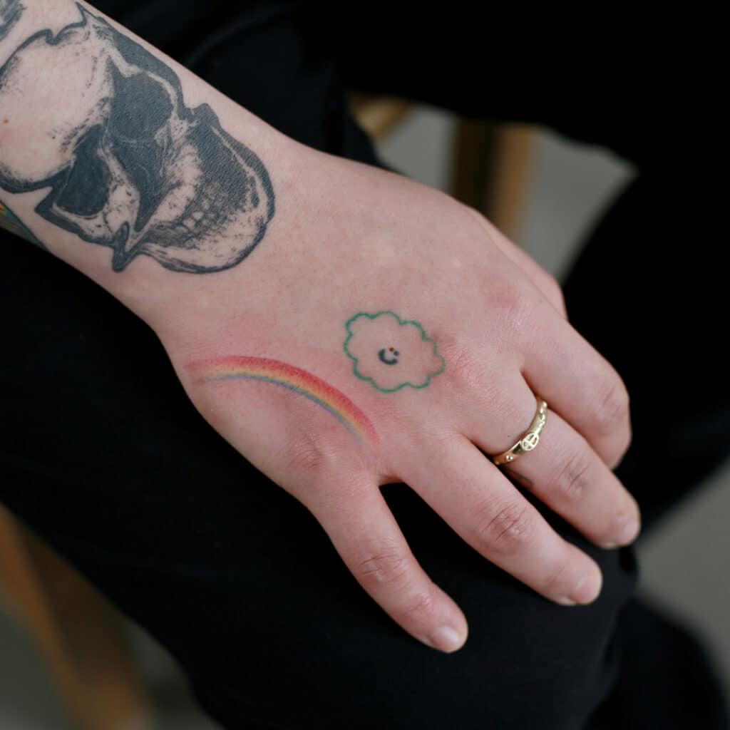 2. A rainbow tattoo on the hand 