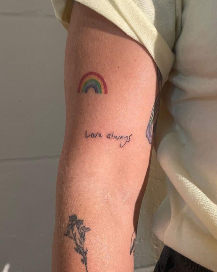 4. A sticker sleeve rainbow tattoo 