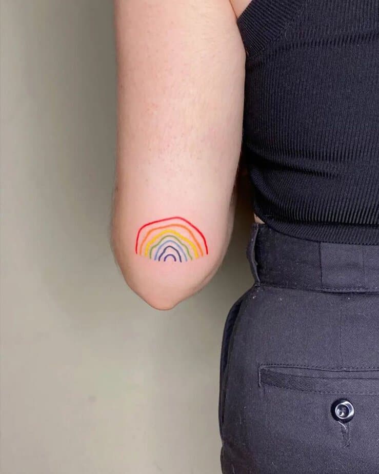 5. A tattoo of a rainbow on the back of the arm