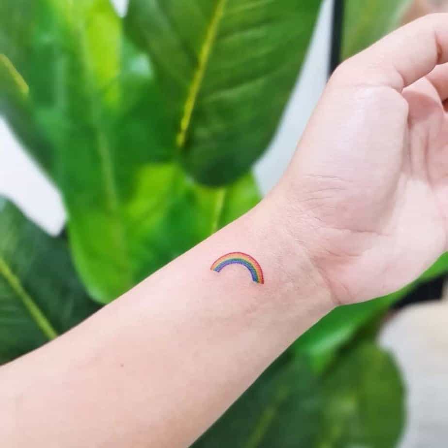9. A tiny rainbow tattoo