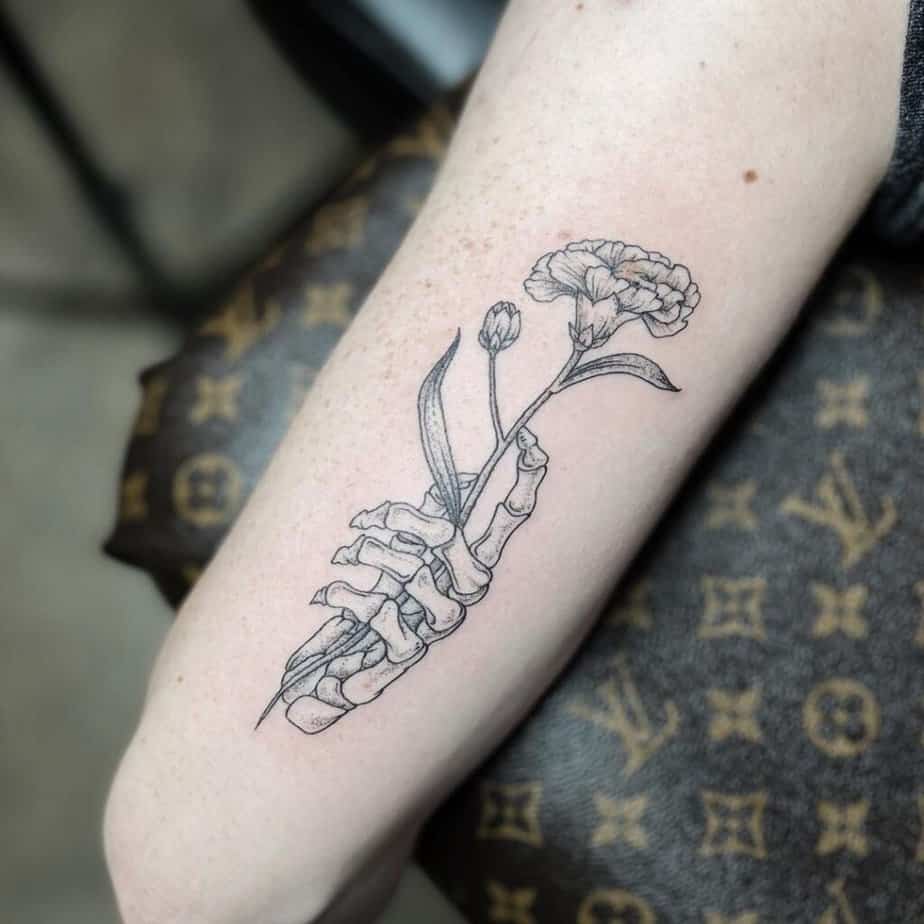 Skeleton hand with flowers