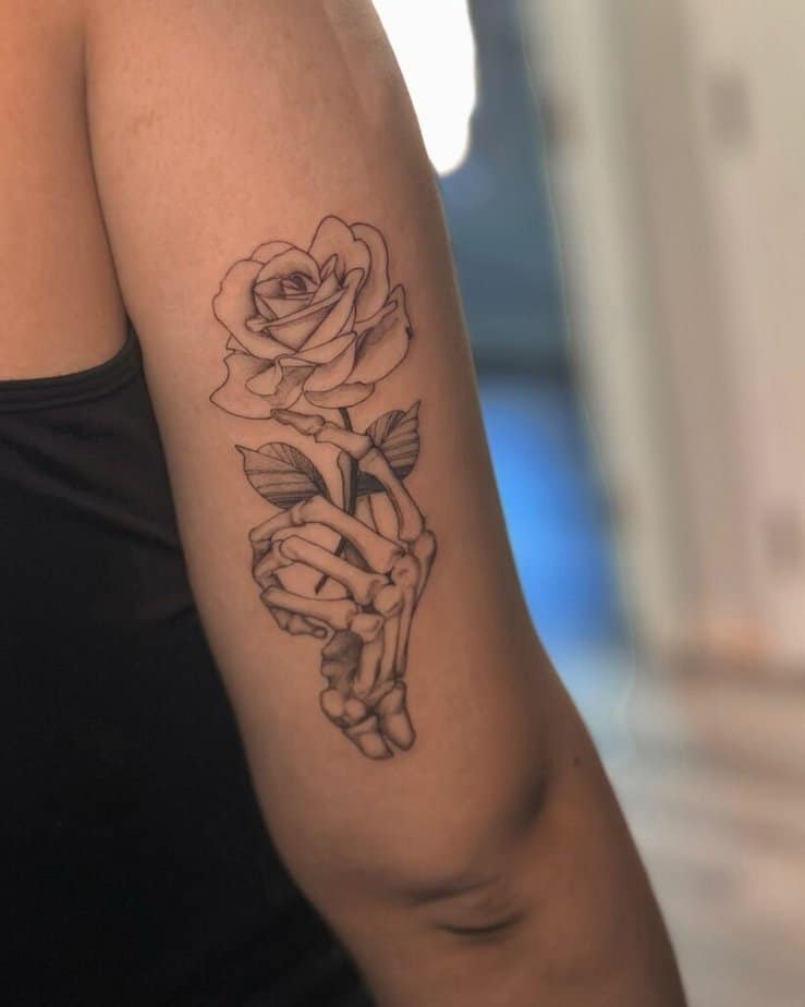 Skeleton hand with flowers