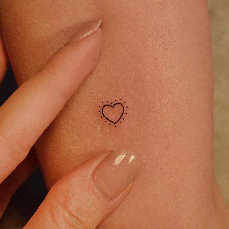 5. A tattoo of a heart with dots