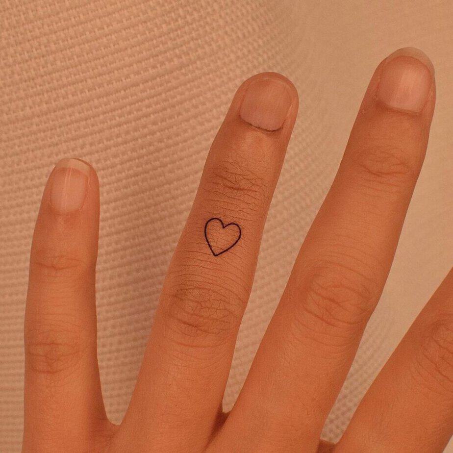 6. A heart tattoo on the knuckle