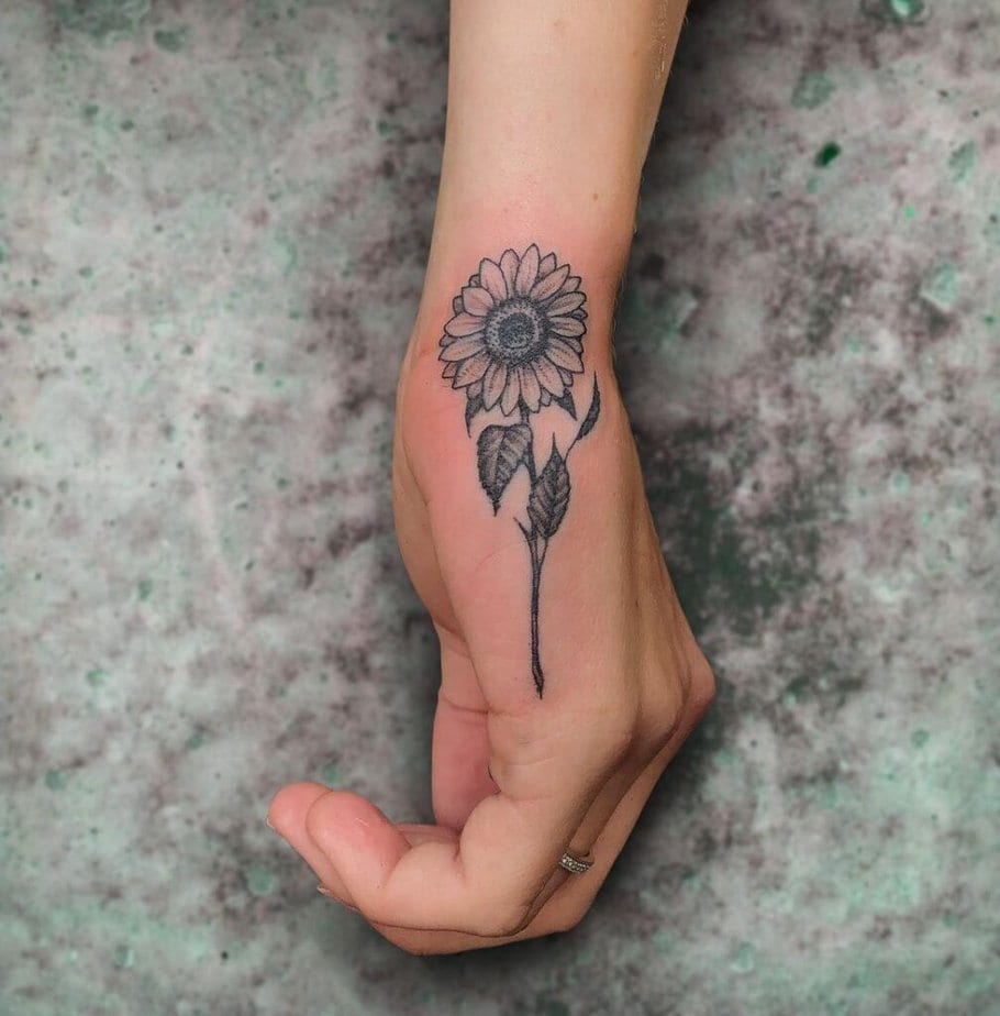 16. A sunflower tattoo on the hand