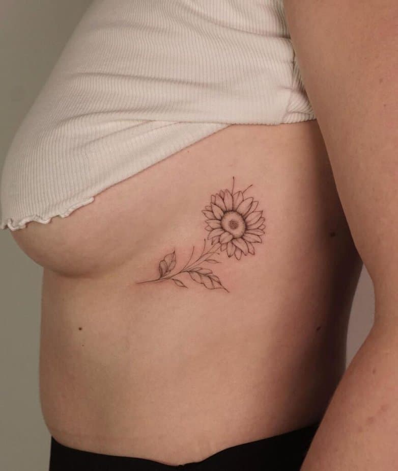 18. A sunflower tattoo on the ribcage