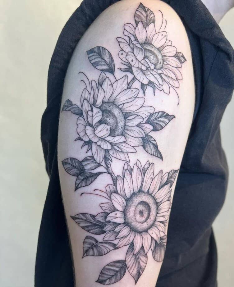 20. A blackwork sunflower tattoo sleeve 