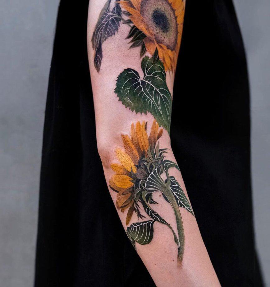 21. A colorful sunflower tattoo sleeve