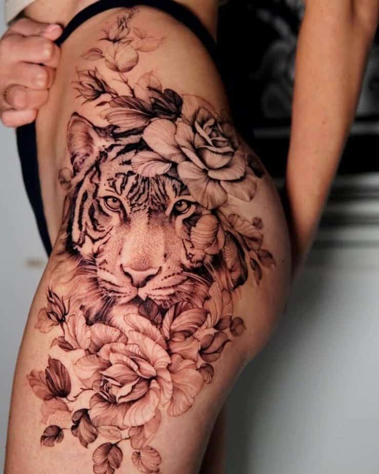16. A tiger surrounded by flowers on the hip