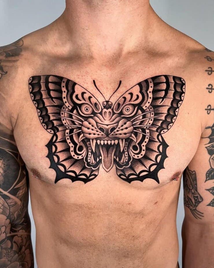 7. A black traditional tattoo of a tiger butterfly on the chest