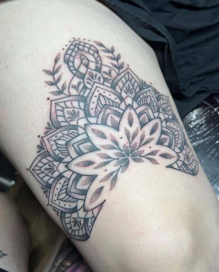 Mandala above knee tattoo