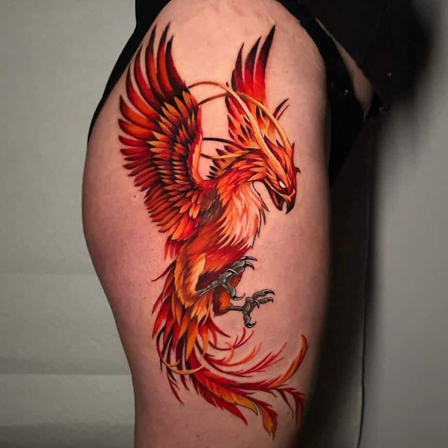 Leg tattoo with flaming phoenix
