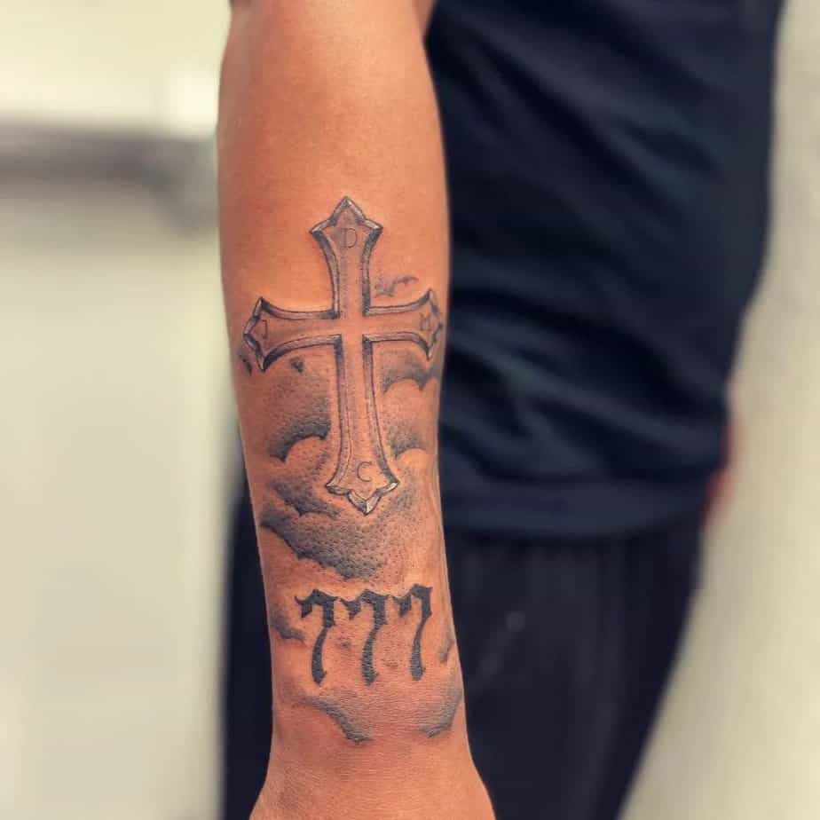 6. A 777 tattoo with a cross