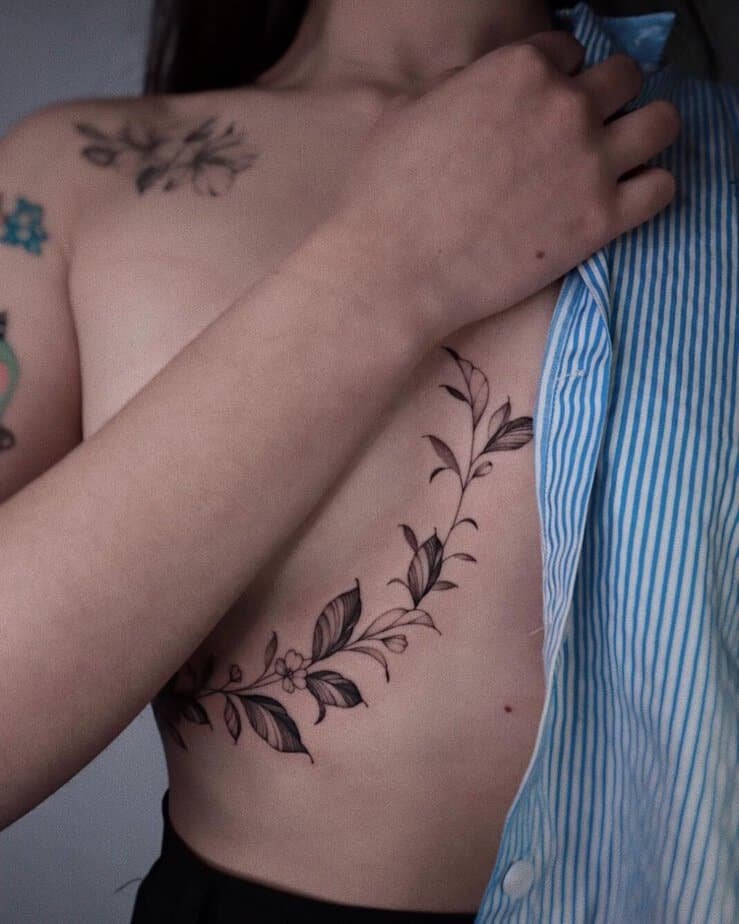 Stay close to your heart with a coffee plant tattoo on your rib cage