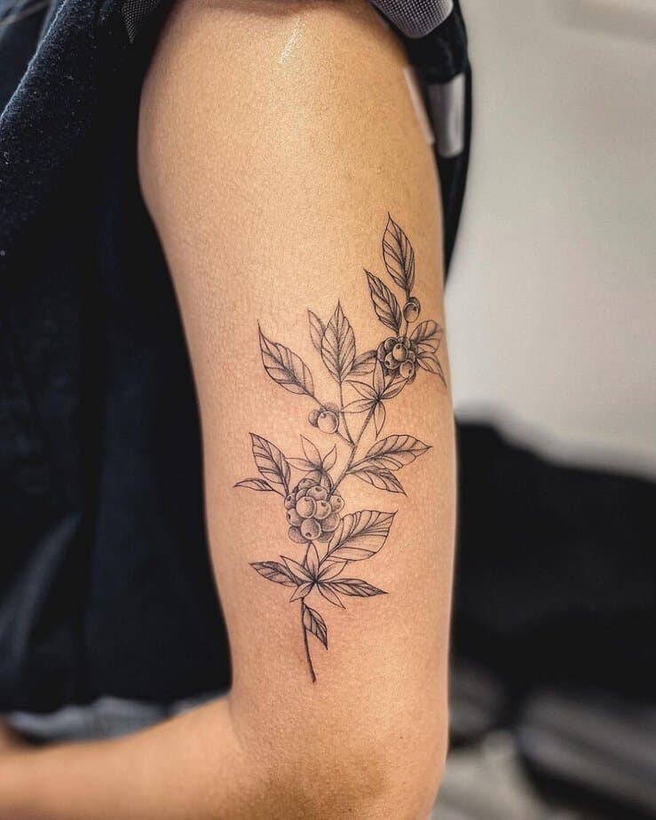 Go for a classic look with a coffee plant on your upper arm