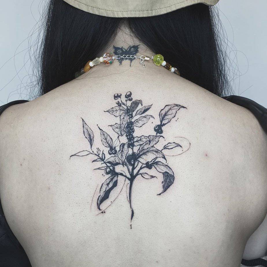 Make a statement with a coffee plant tattoo on your back
