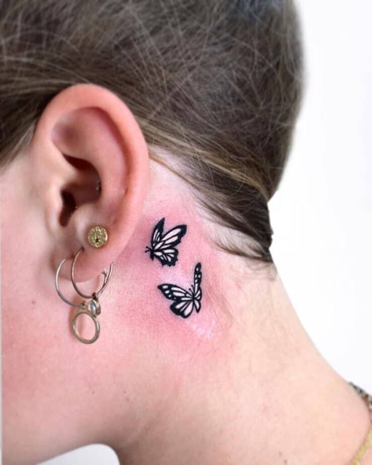 19. Another tattoo of two black-and-white butterflies 