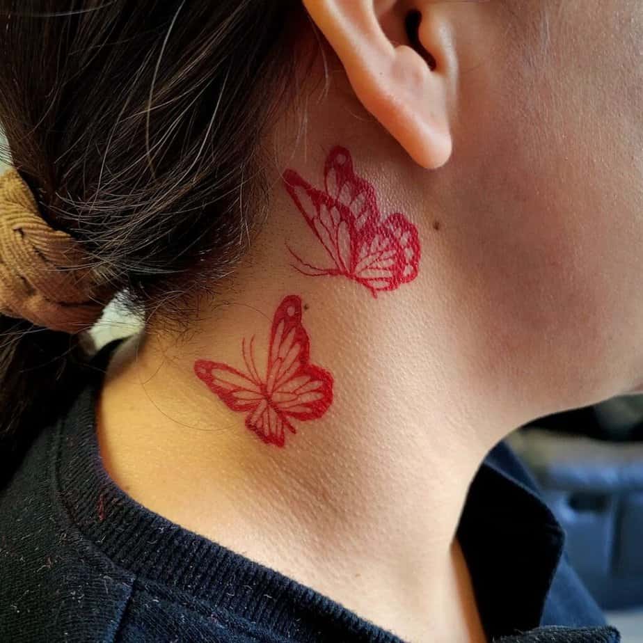 2. A tattoo of two red butterflies 
