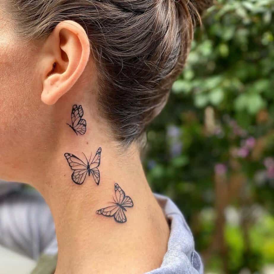 20. Un tatuaggio a linee sottili di farfalle che volano via 
