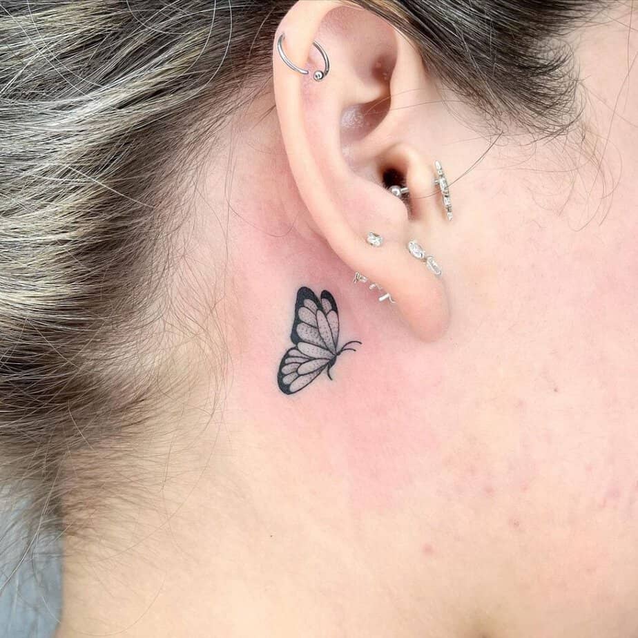 22. A single butterfly tattoo behind the ear 